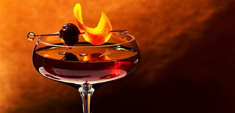 basil hayden bourbon and cherry on glass