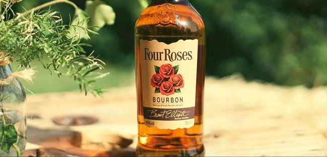four roses bourbon whiskey bottle on table