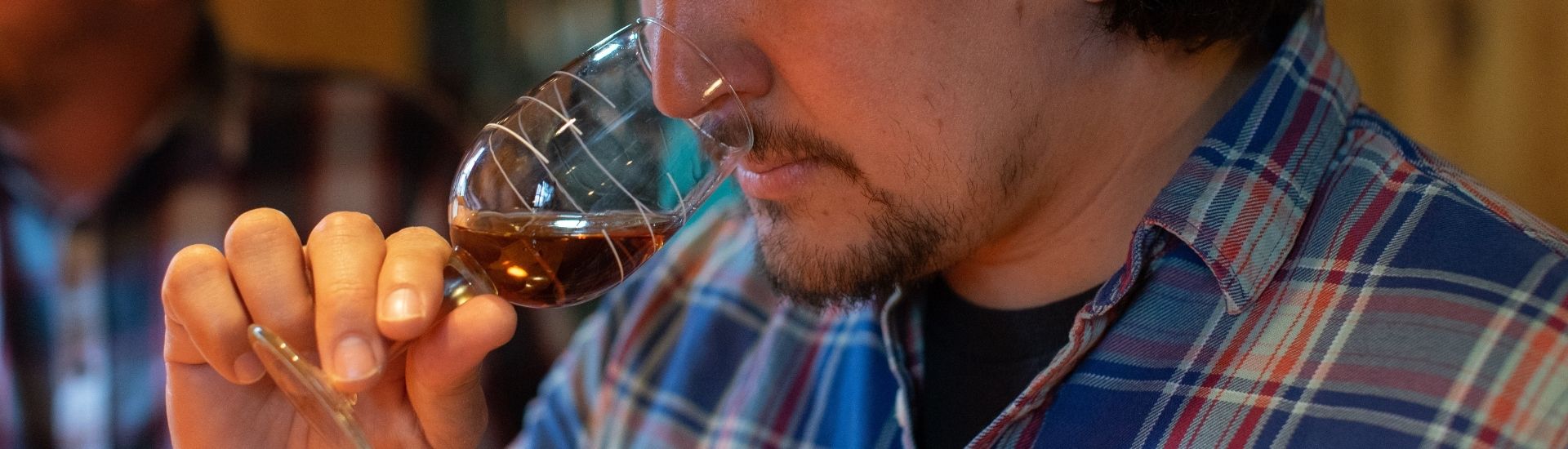 guest smelling a glass of buffalo trace bourbon