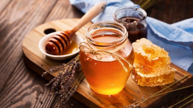 honey in jar on table