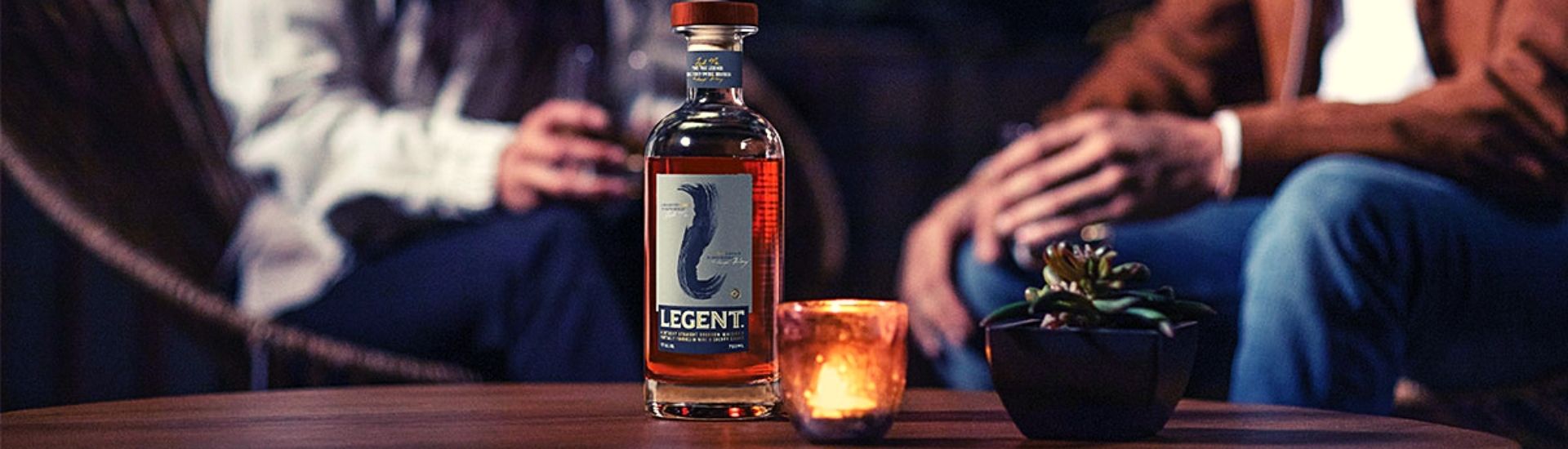 legent bourbon bottle and glass on table