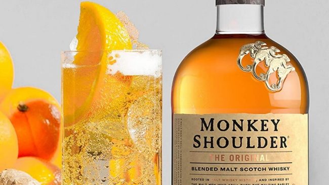 monkey shoulder blended malt scotch whisky and glass with lemon