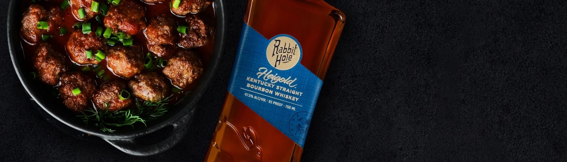 rabbit hole heigold bourbon bottle with food