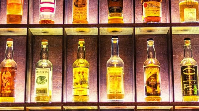 whiskey bottles on shelves